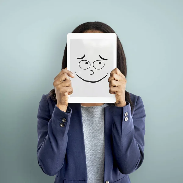 Businesswoman covering face with digital tablet — Stock Photo, Image