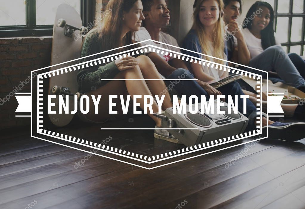 Multiethnic teenagers sitting on floor with boombox, skateboard and pizza, title: Enjoy Every Moment