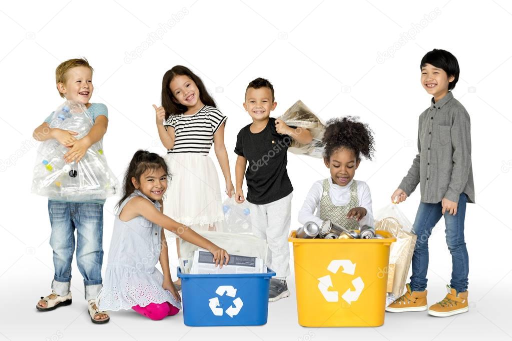 Group of adorable kids with waste for recycling