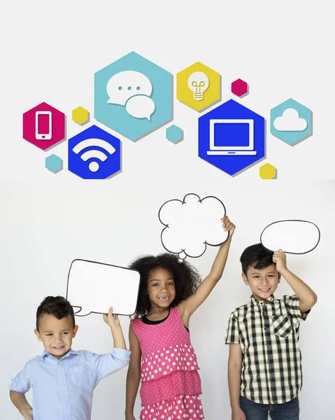 Children holding overhead speech bubbles — Stock Photo, Image