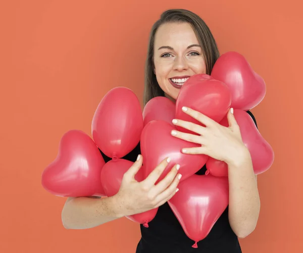 Woman and heart balloons — Stock Photo, Image