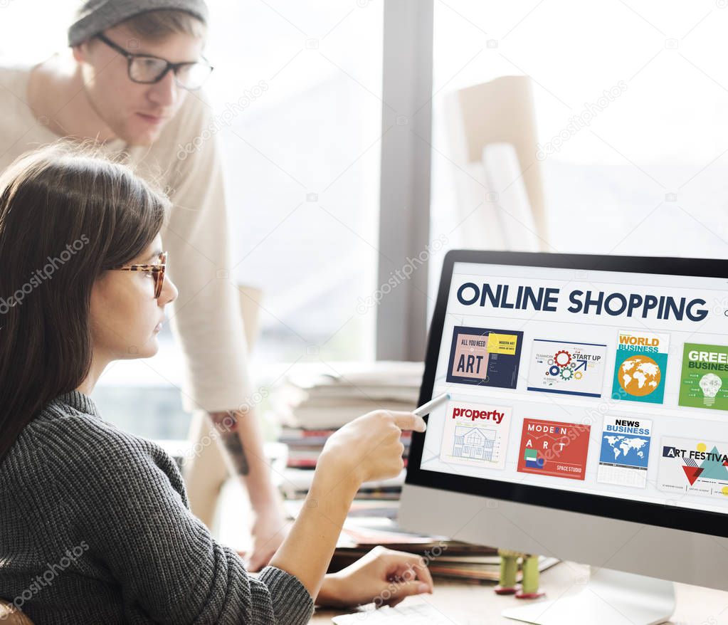 People looking on computer screen with text: Online Shopping