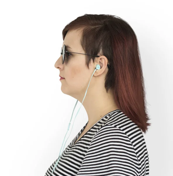 Woman in sunglasses listening music — Stock Photo, Image