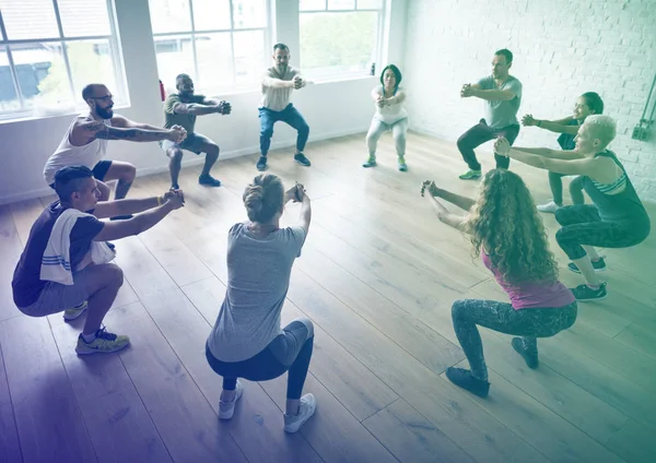 People doing physical exercises — Stock Photo, Image