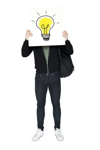 Man håller banner med glödlampa — Stockfoto