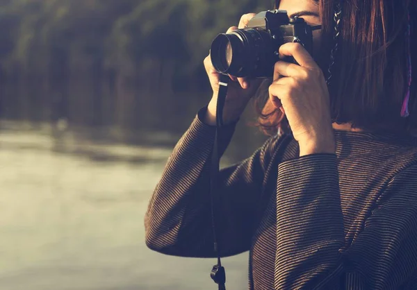 Woman Taking picture on photo camera — Stock Photo, Image
