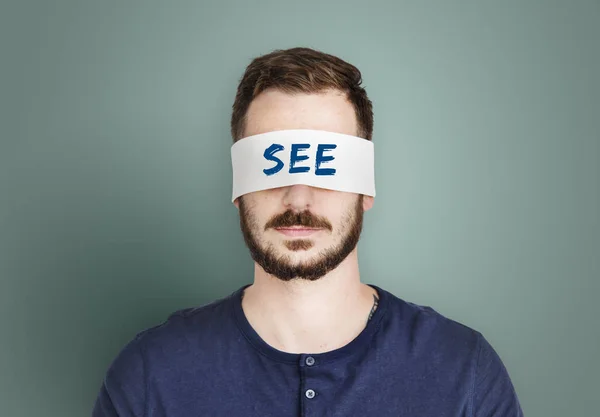 Hombre cubriendo los ojos con cinta —  Fotos de Stock