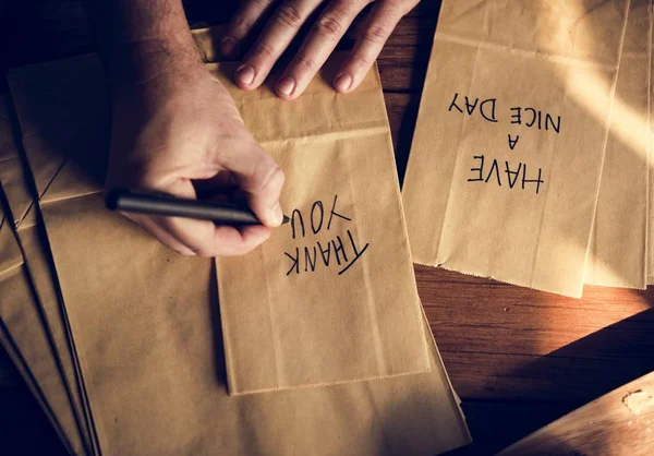 Person Hands Writing Thankful Words Paper Bag Original Photoset — Stock Photo, Image