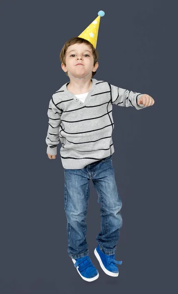 Boy dancing in party hat — Stock Photo, Image