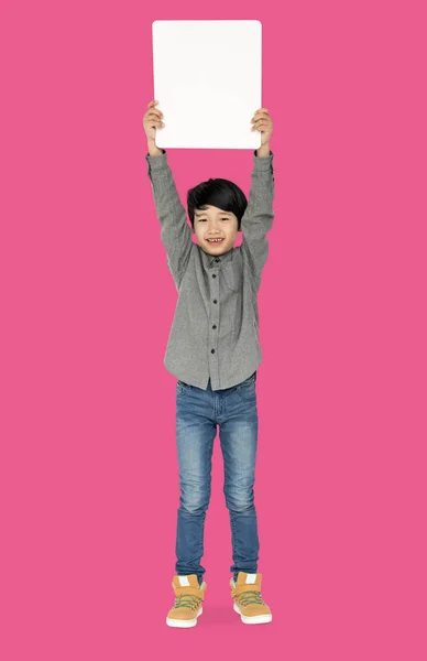 Boy holding blank board — Stock Photo, Image