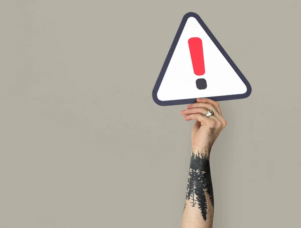 Man Holding Caution Sign — Stock Photo, Image