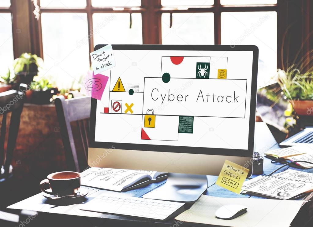 Computer monitor on table, title on screen: Cyber Attack