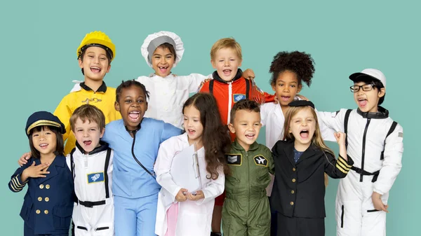 Kinderen in kostuums van diverse beroepen — Stockfoto