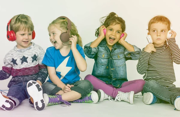 Cheerful children listen music — Stock Photo, Image