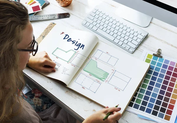 Designer drawing in album — Stock Photo, Image