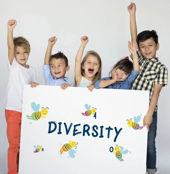 Little children holding placard — Stock Photo, Image