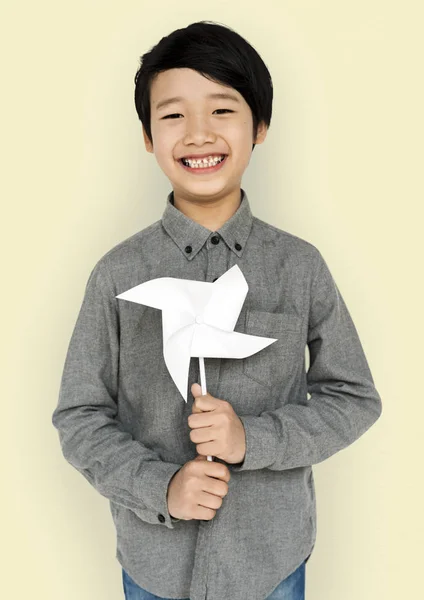 Asian boy with toy windmill — Stock Photo, Image
