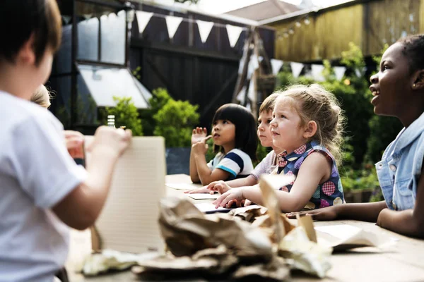 children learning how to separate trash