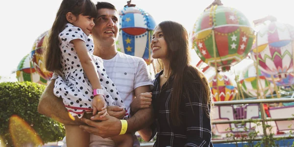 Family having fun in amusement park — Stock Photo, Image