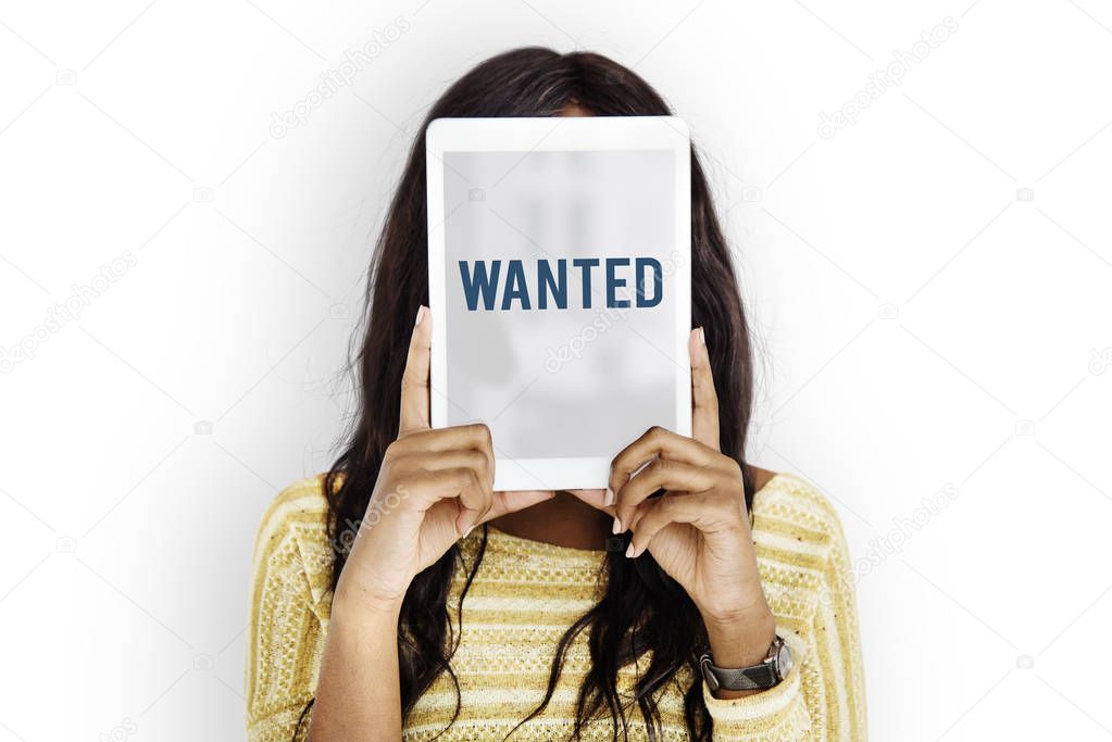 woman holding digital tablet covering face