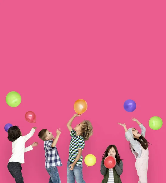 Children playing with balloons — Stock Photo, Image