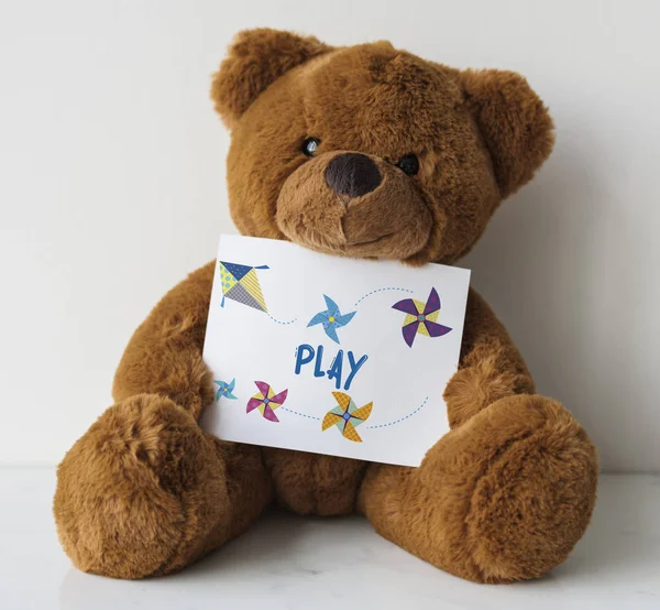 Urso de pelúcia com cartão — Fotografia de Stock