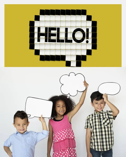 Children holding overhead speech bubbles — Stock Photo, Image
