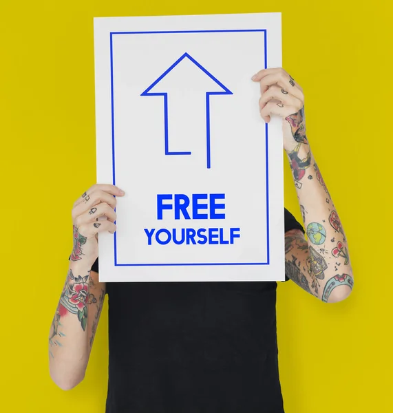 Tattooed person holding banner. — Stock Photo, Image