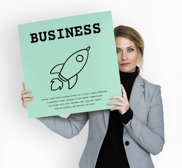 Businesswoman holding placard — Stock Photo, Image