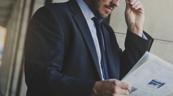 Businessman reading newspaper — Stock Photo, Image