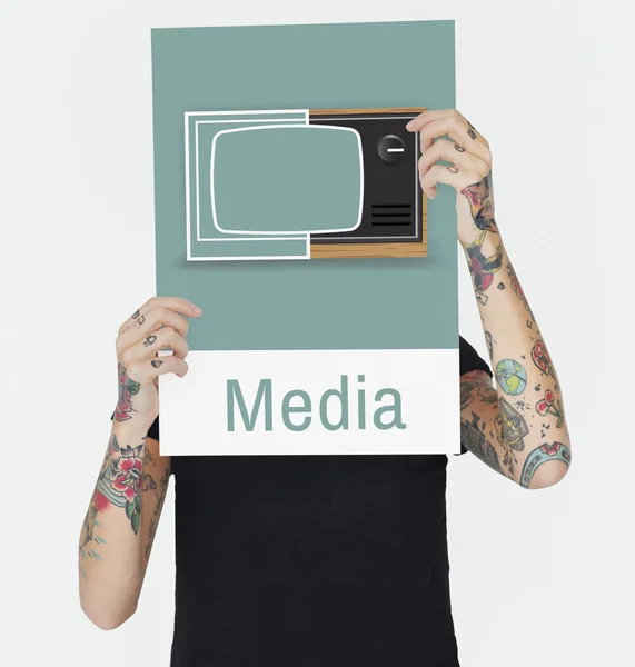 Tattooed person holding banner. — Stock Photo, Image