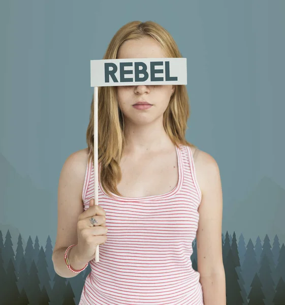 Woman covering eyes with paper flag — Stock Photo, Image