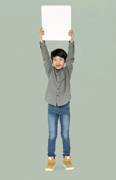 Boy holding blank board — Stock Photo, Image