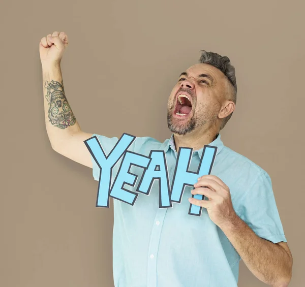 Man with paper yeah word — Stock Photo, Image