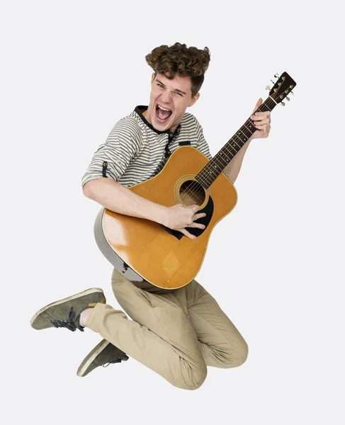 Man jumping  with guitar — Stock Photo, Image
