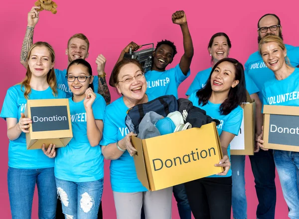 Volunteers holding boxes — Stock Photo, Image