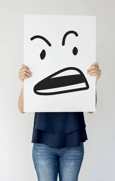 Person holding paper placard — Stock Photo, Image