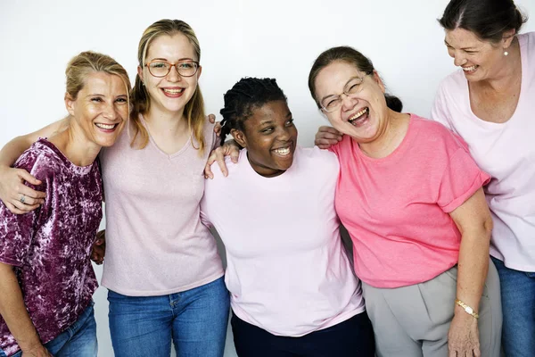 Women embracing in studio — Stock Photo, Image