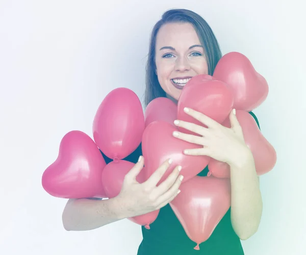 Woman and heart balloons — Stock Photo, Image