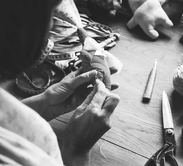 Woman hands sewing soft doll toy — Stock Photo, Image