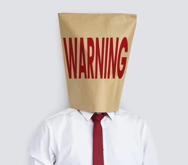 Homme d'affaires avec sac en papier sur la tête — Photo
