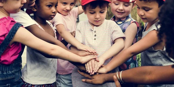 Students  staking hands together — Stock Photo, Image