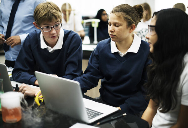 school students using laptop