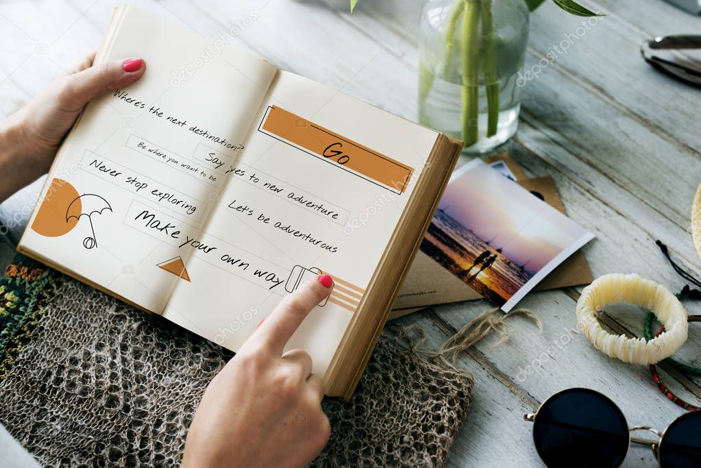 hands holding book