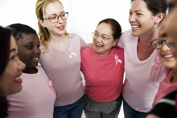 Women embracing in studio — Stock Photo, Image