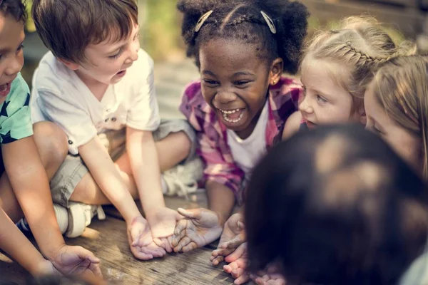 Students showing hands in the chalk — Stock Photo, Image