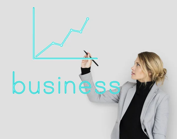 Businesswoman drawing on the wall — Stock Photo, Image