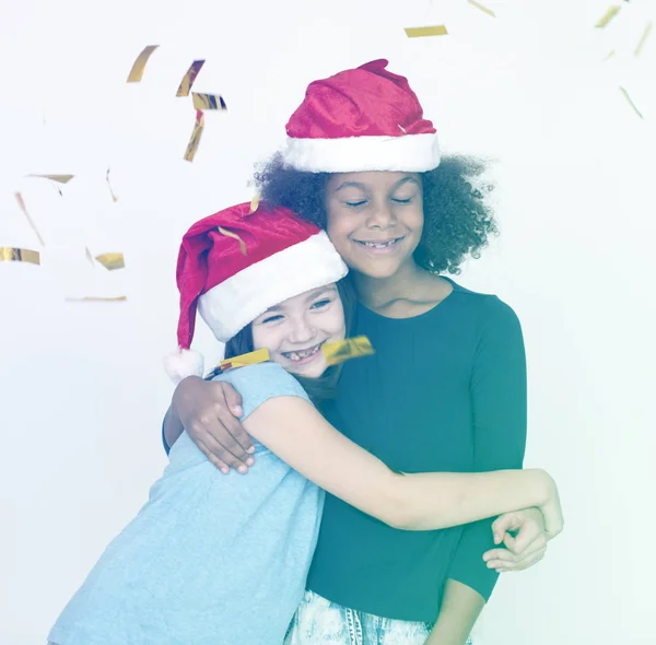 Meninas em santa claus chapéus — Fotografia de Stock