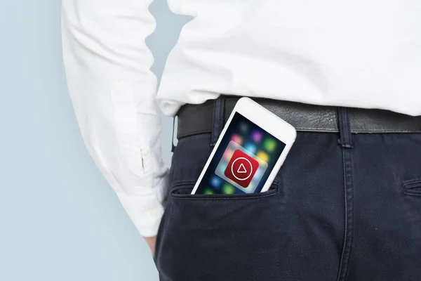 Hombre de negocios con smartphone en el bolsillo — Foto de Stock