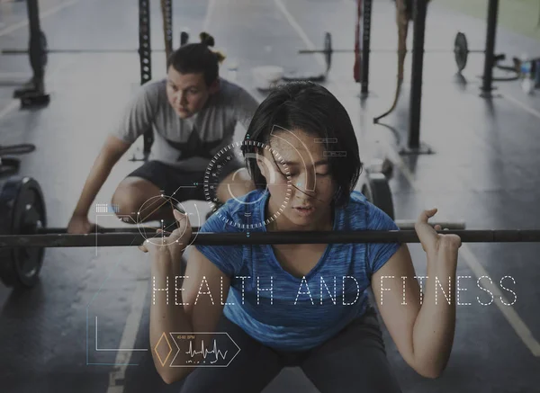 Vrouw en man training met halters — Stockfoto